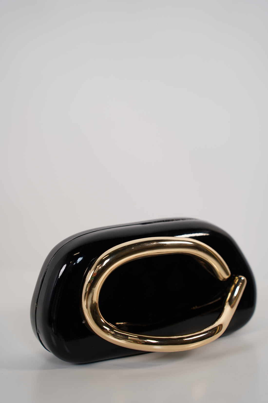 Bellora Shiny Clutch – Sculpted Gloss Statement Bag