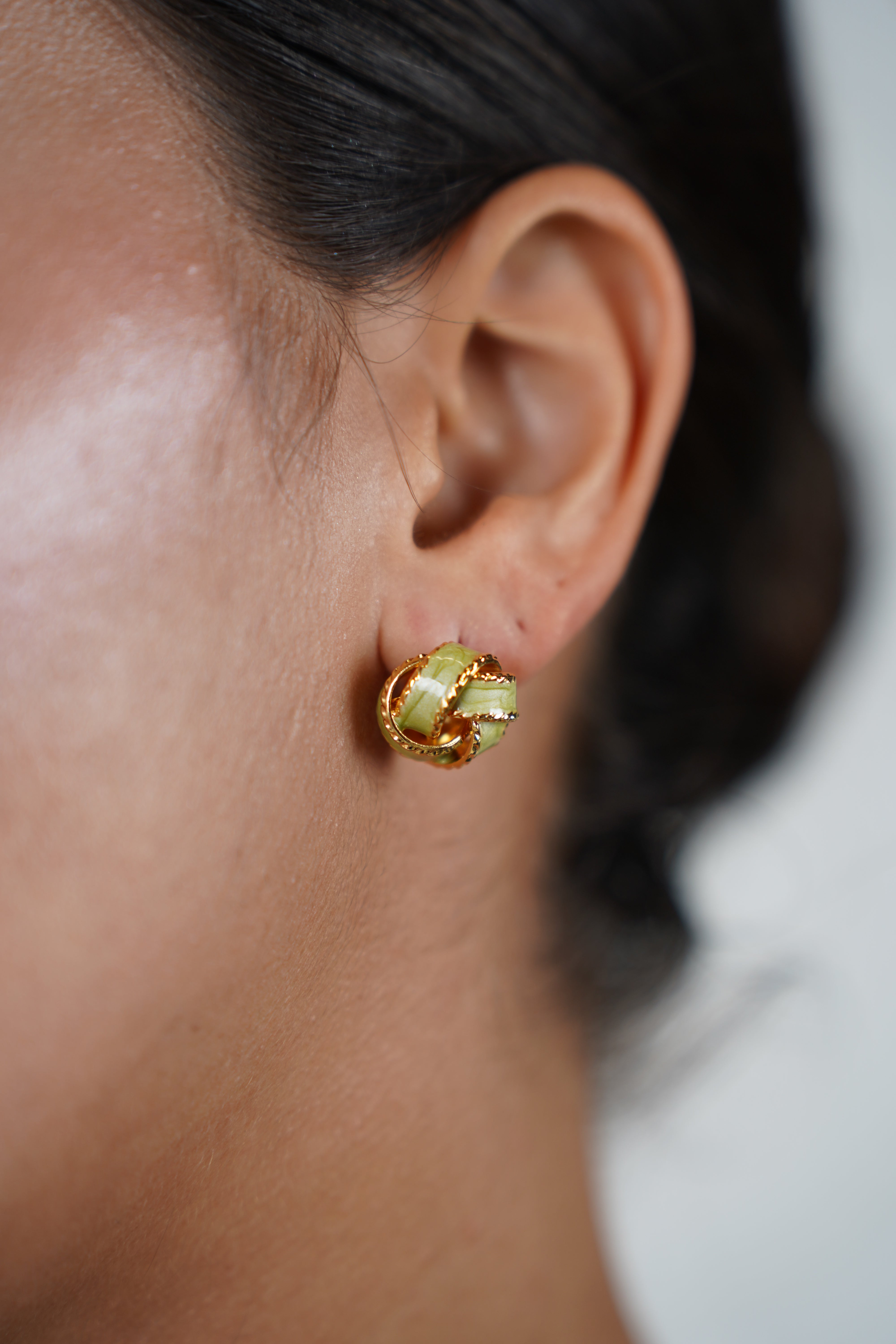 Yezel Knot Studs – Classic Twist with a Touch of Red