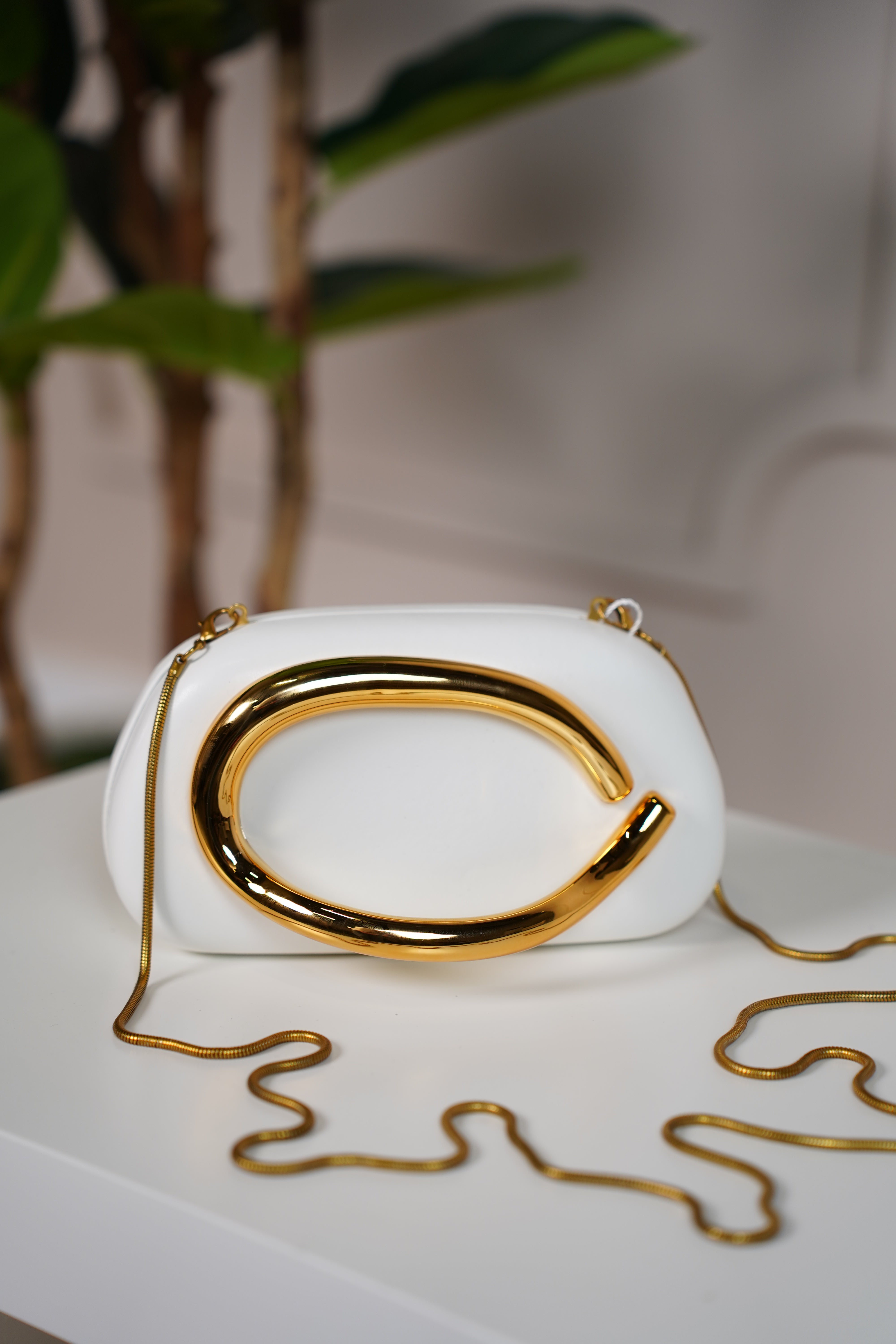 Zalia Trendy Clutch – Sculptural Elegance with a Bold Gold Accent