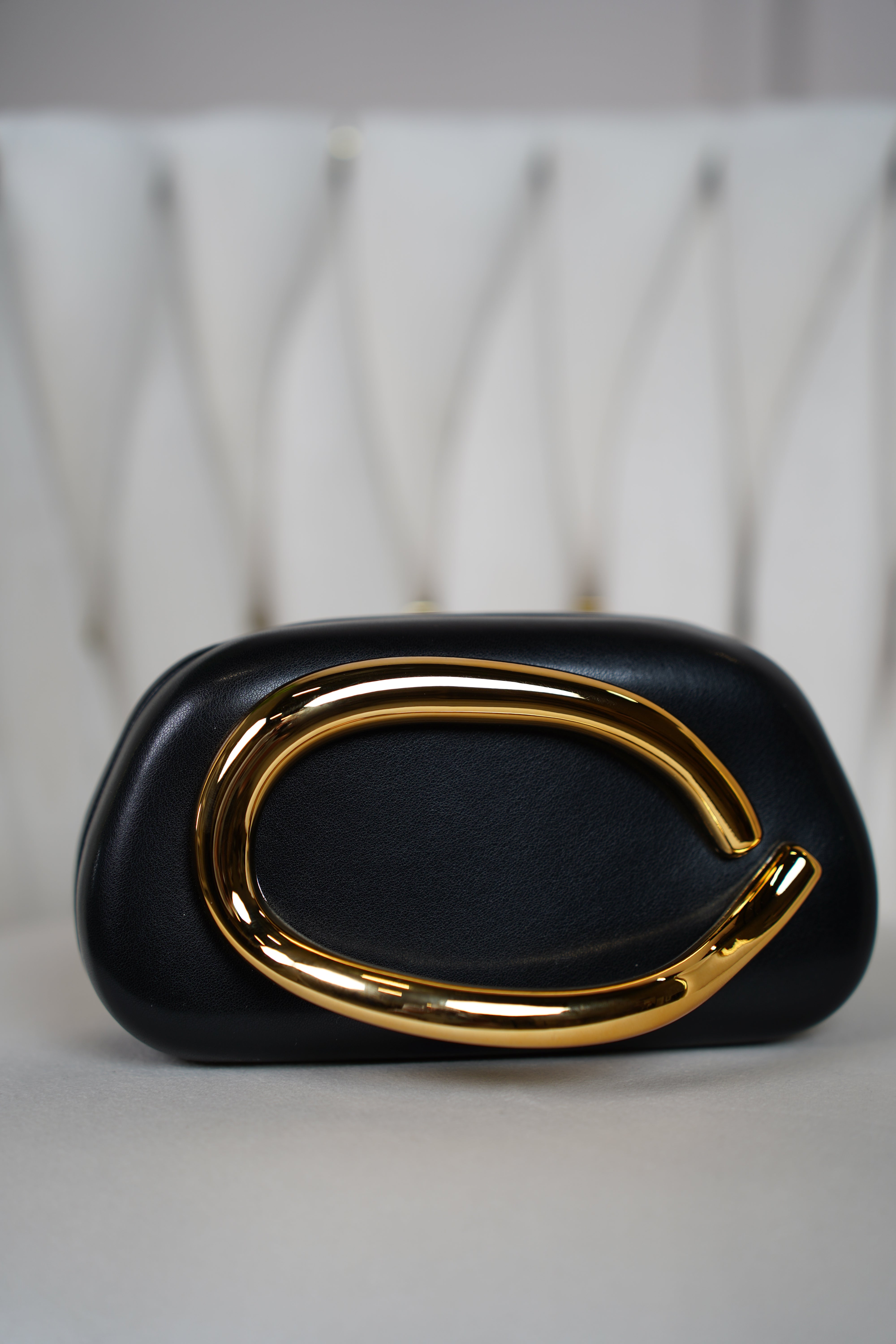 Zalia Trendy Clutch – Sculptural Elegance with a Bold Gold Accent