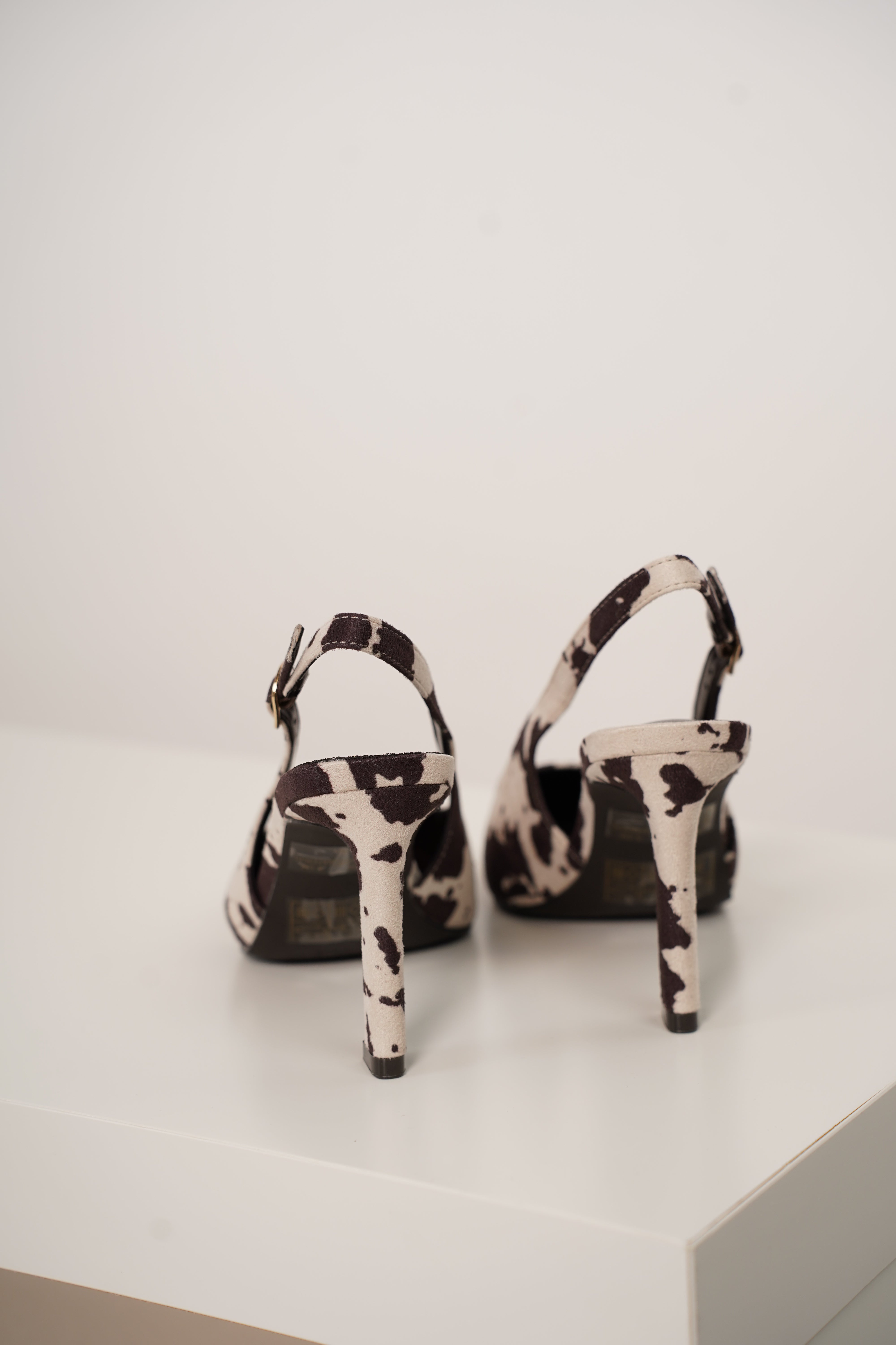 Unity Cow Print Pumps – Edgy Chic with a Western Twist