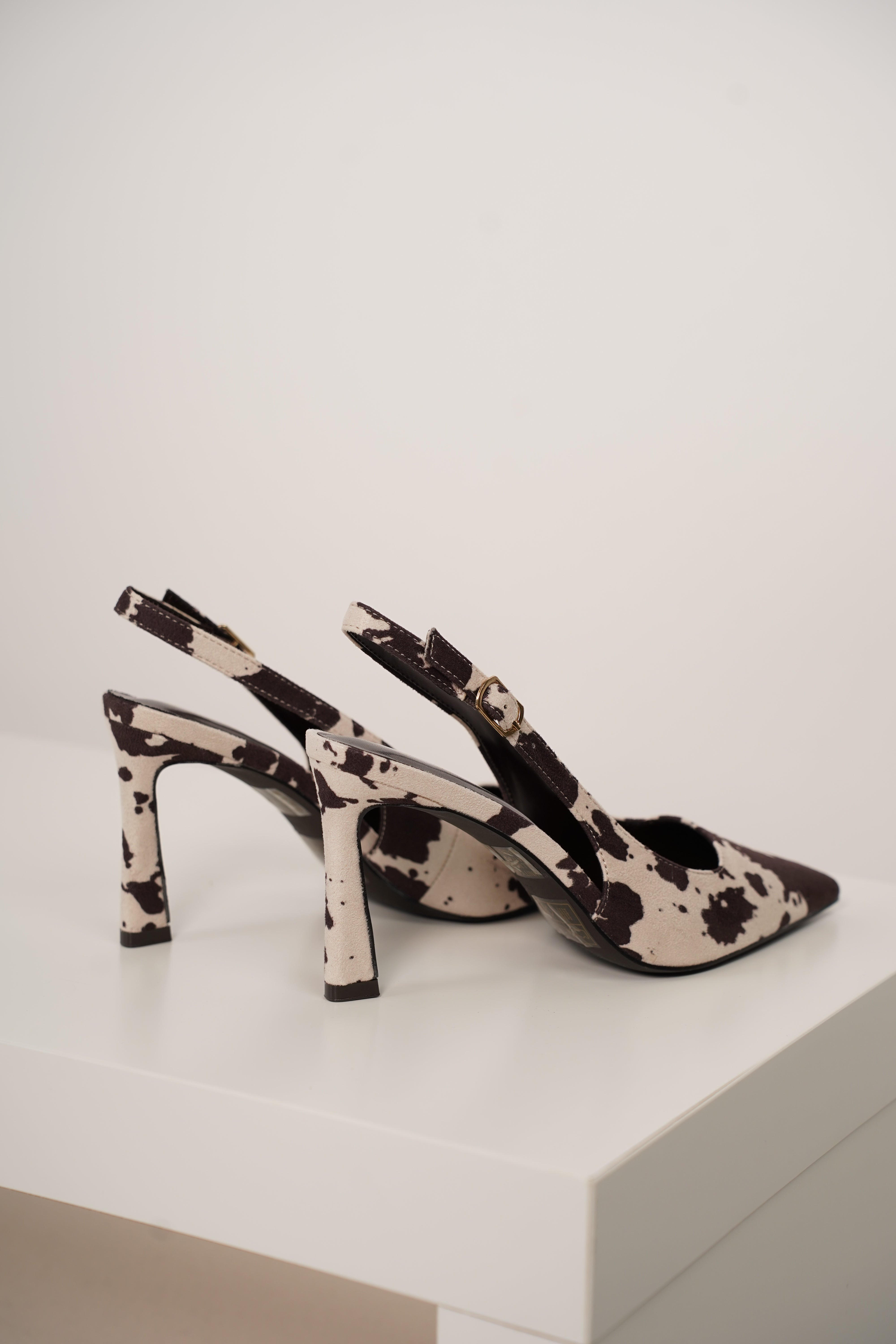 Unity Cow Print Pumps – Edgy Chic with a Western Twist