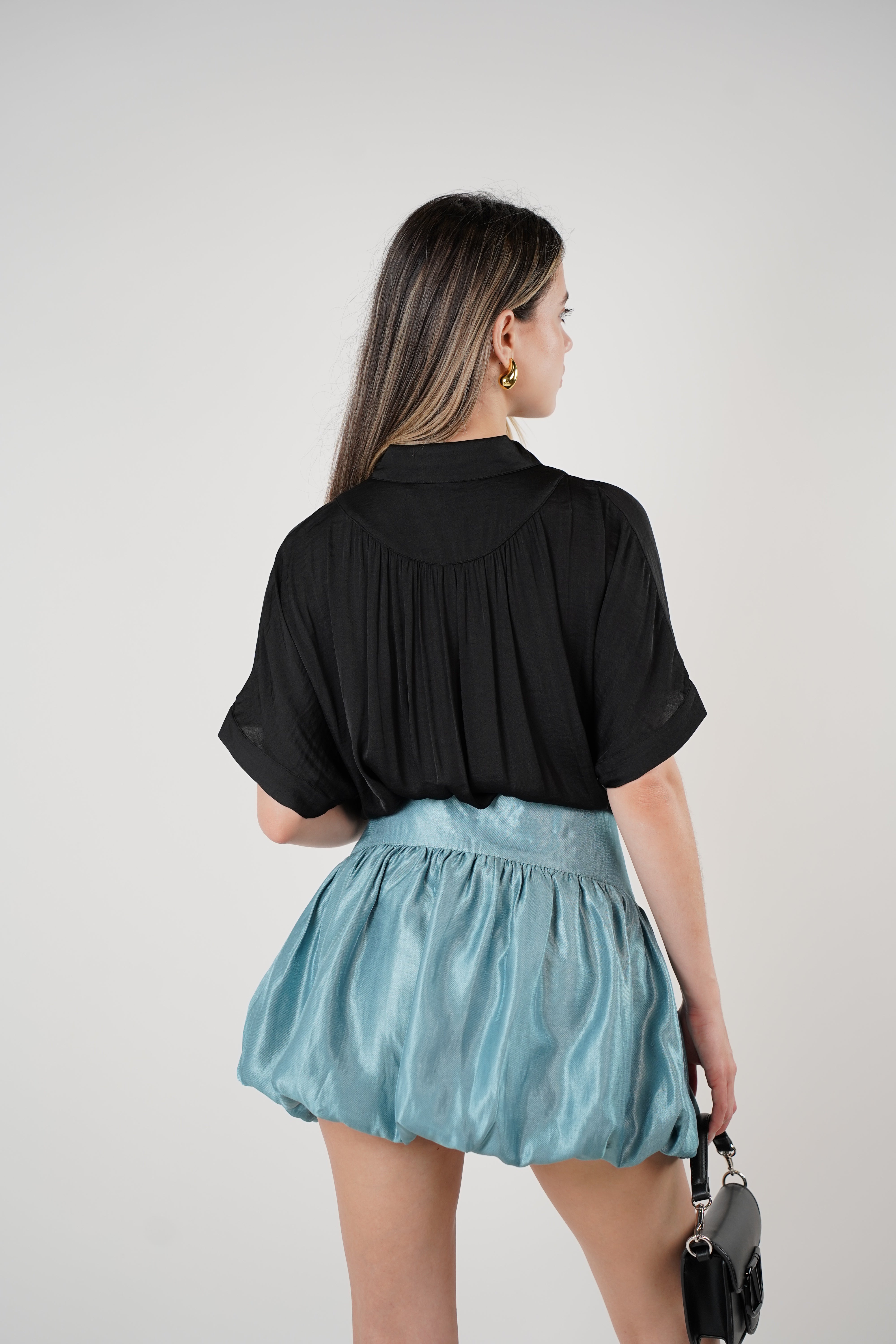 Jeyra Flaca Top – Draped Black Blouse with Modern Ease