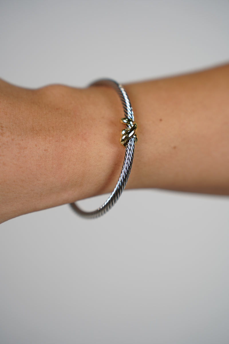 Runi Cross Bracelet – Sleek Cable Bangle with Golden Knot Accent