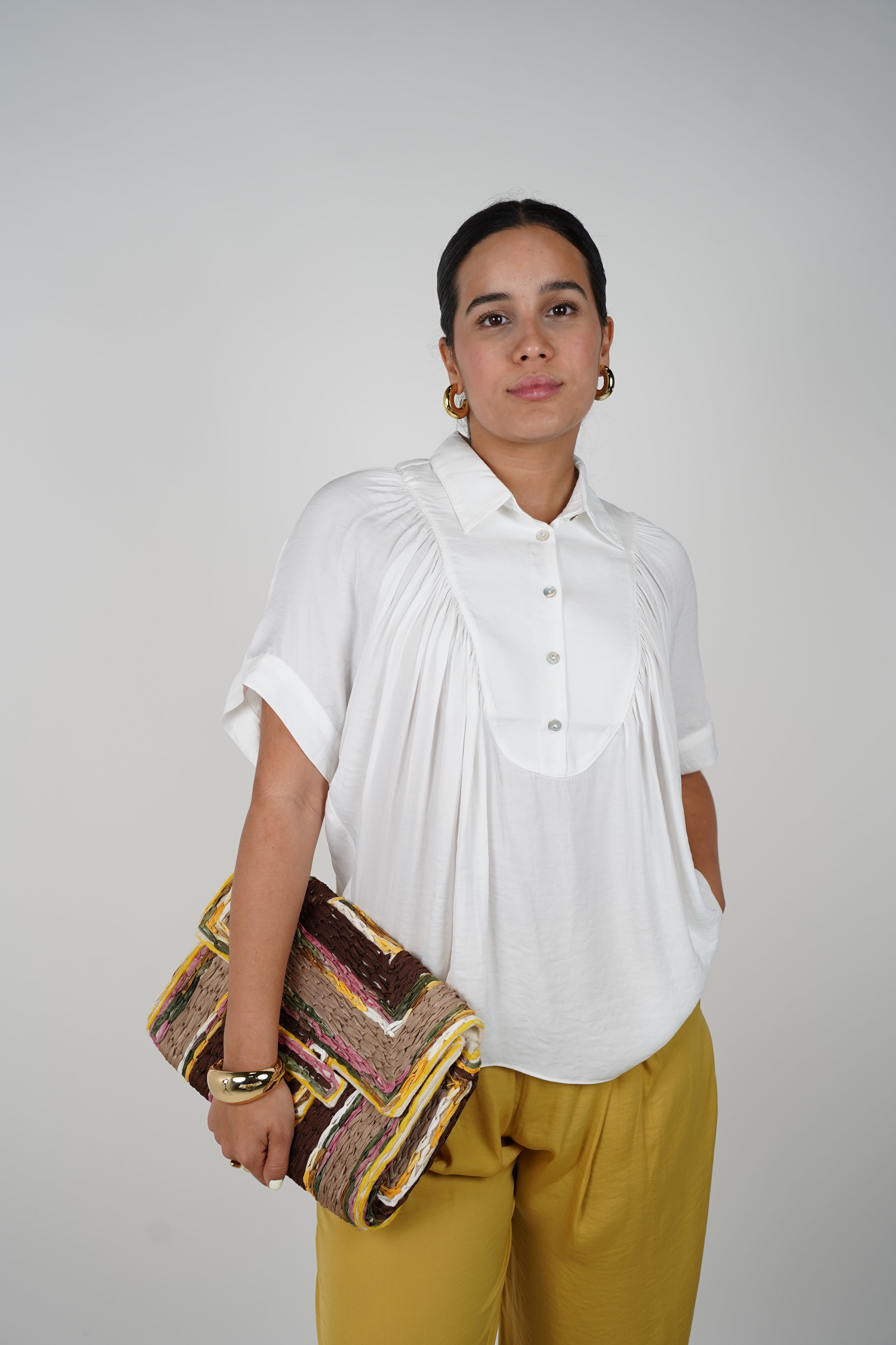 Jeyra Flaca Top – Draped Black Blouse with Modern Ease