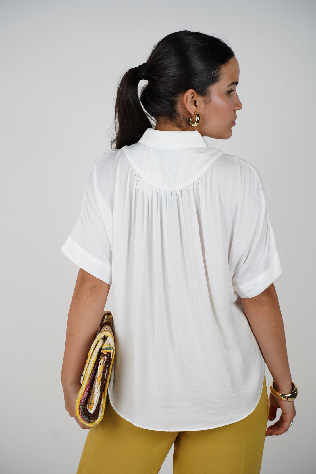 Jeyra Flaca Top – Draped Black Blouse with Modern Ease